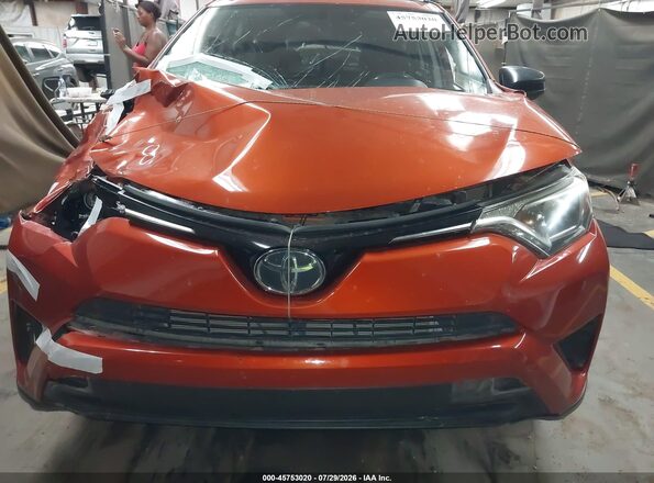 JTMZFREV1GJ089869 2016 TOYOTA RAV4 Orange Front view