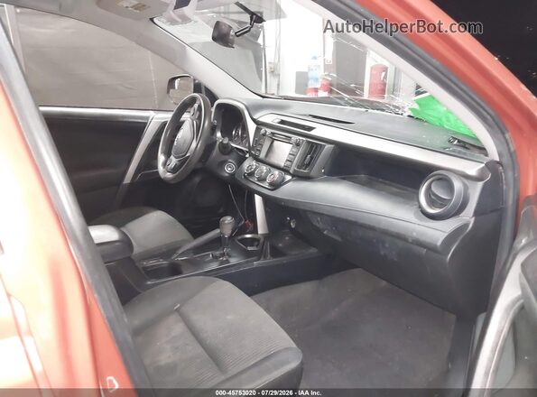 JTMZFREV1GJ089869 2016 TOYOTA RAV4 Orange Front interior view