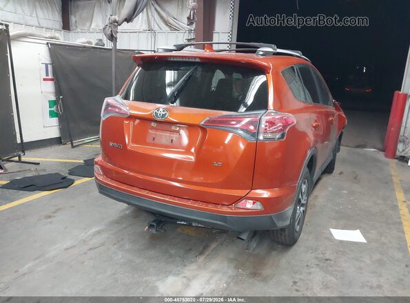 JTMZFREV1GJ089869 2016 TOYOTA RAV4 Orange Rear right