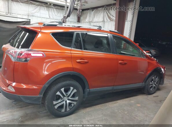 JTMZFREV1GJ089869 2016 TOYOTA RAV4 Orange Rear interior view