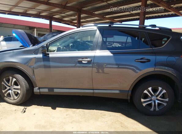 JTMZFREV1HD099723 2017 TOYOTA RAV4 Gray Вид задньої частини салону