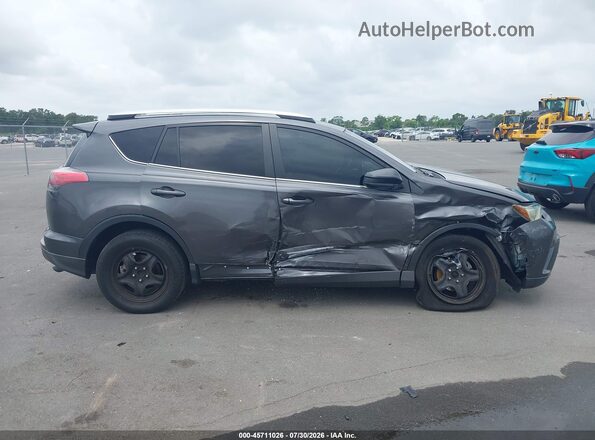 JTMZFREV2GJ083434 2016 TOYOTA RAV4 Серый Вид задней части салона