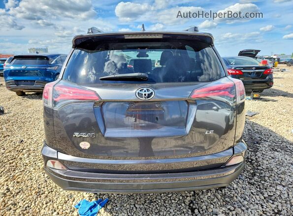 JTMZFREV3JJ185574 2018 TOYOTA RAV4 Gray Rear view