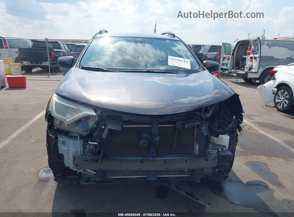JTMZFREV6JJ167649 2018 TOYOTA RAV4 Gray Vista interior trasera