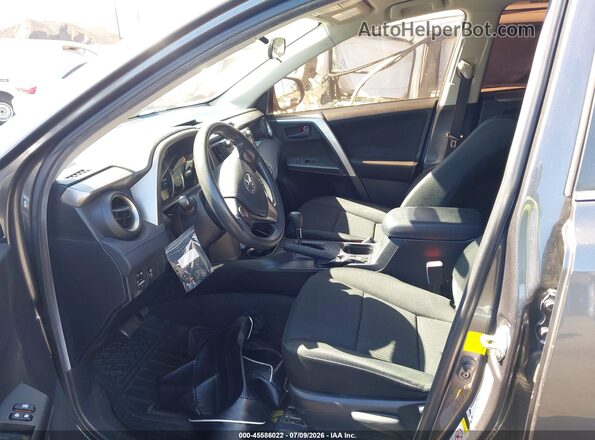 JTMZFREV9GJ066405 2016 TOYOTA RAV4 Gray Front interior view