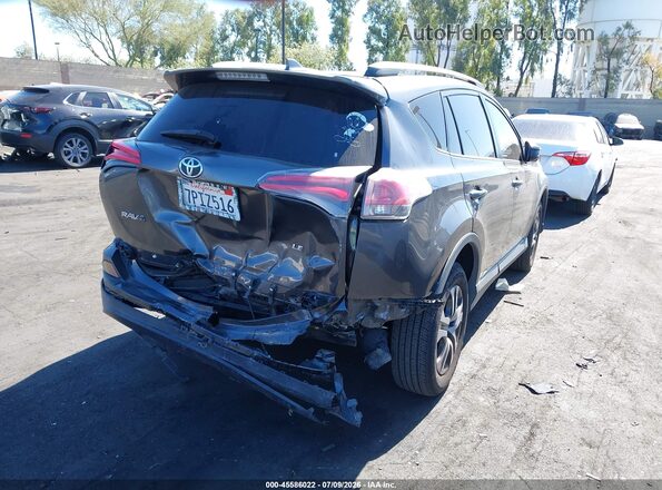 JTMZFREV9GJ066405 2016 TOYOTA RAV4 Gray Front view