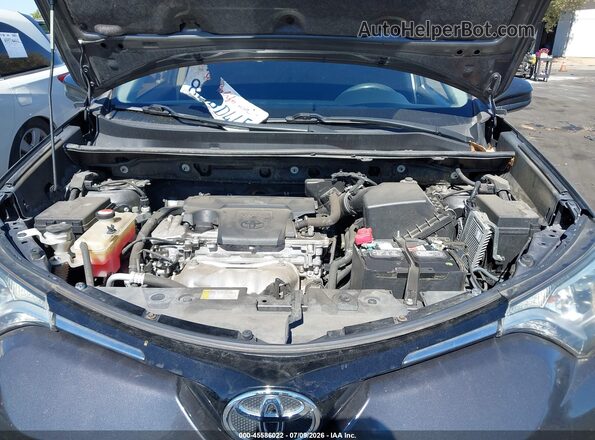 JTMZFREV9GJ066405 2016 TOYOTA RAV4 Gray Rear view