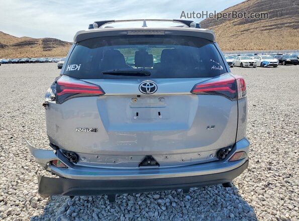 JTMZFREV9JD126253 2018 TOYOTA RAV4 Silver Հետևի տեսք