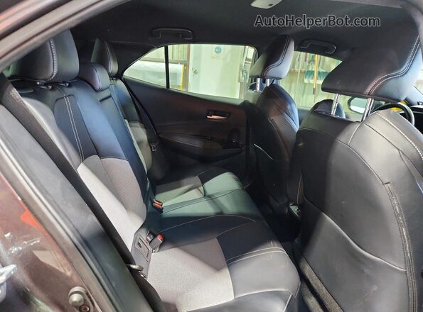 JTNC4MBE9P3206570 2023 TOYOTA COROLLA Gray Vista interior trasera