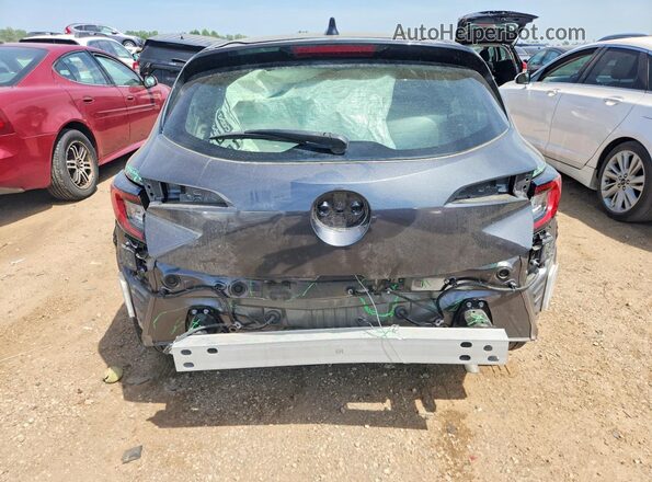 JTND4MBE9P3208808 2023 TOYOTA COROLLA Gray Rear view