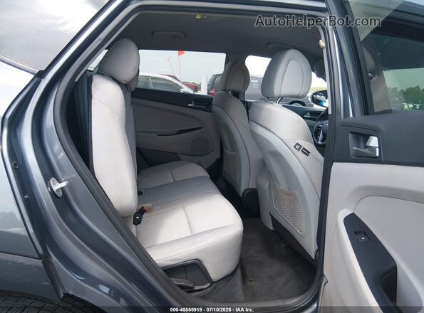 KM8J2CA44JU677897 2018 HYUNDAI TUCSON Gray VIN კოდის სტიკერის ხედი