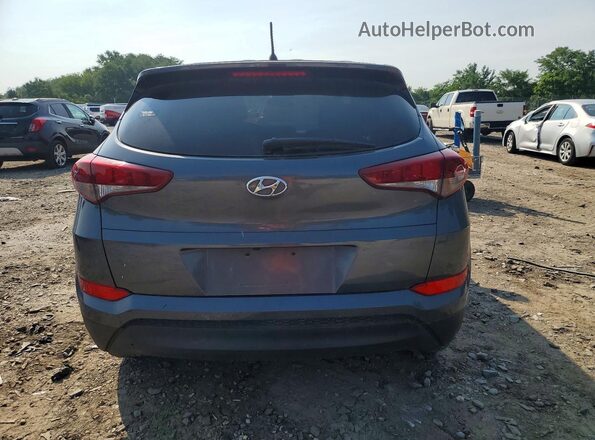 KM8J2CA45JU618339 2018 HYUNDAI TUCSON Gray Vista trasera