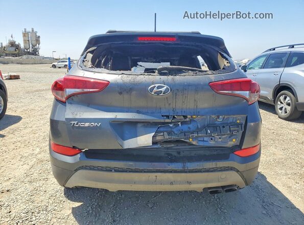 KM8J33A20HU387744 2017 HYUNDAI TUCSON Gray Rear view