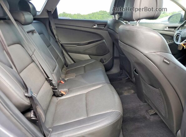 KM8J33A23GU199783 2016 HYUNDAI TUCSON Gray Widok wnętrza z tyłu
