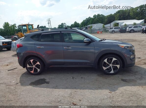 KM8J33A26GU103760 2016 HYUNDAI TUCSON Gray უკანა სალონის ხედი