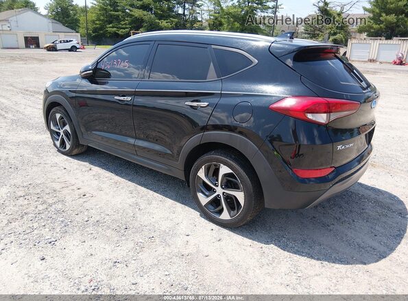 KM8J33A26GU139870 2016 HYUNDAI TUCSON Black Trasero izquierdo