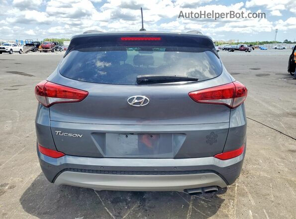 KM8J33A26HU575443 2017 HYUNDAI TUCSON Gray Rear view