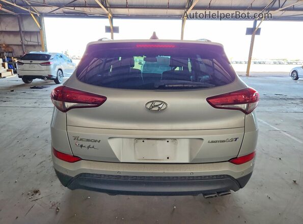 KM8J33A2XGU091869 2016 HYUNDAI TUCSON Silver უკანა ხედი