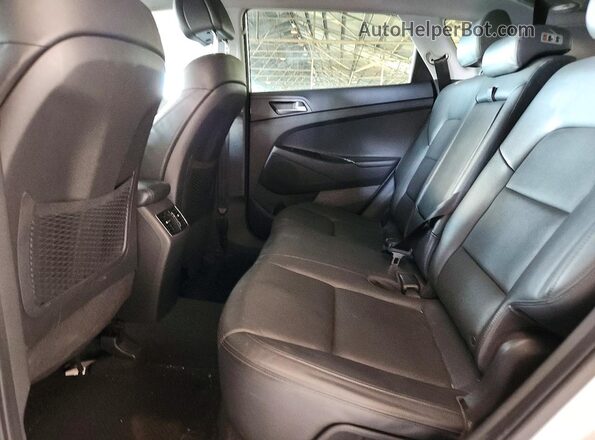 KM8J33A2XGU091869 2016 HYUNDAI TUCSON Silver უკანა სალონის ხედი