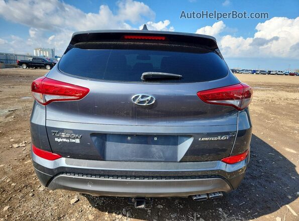 KM8J33A2XGU138608 2016 HYUNDAI TUCSON Gray Вид ззаду