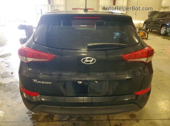 KM8J33A40GU040737 2016 HYUNDAI TUCSON Black უკანა ხედი