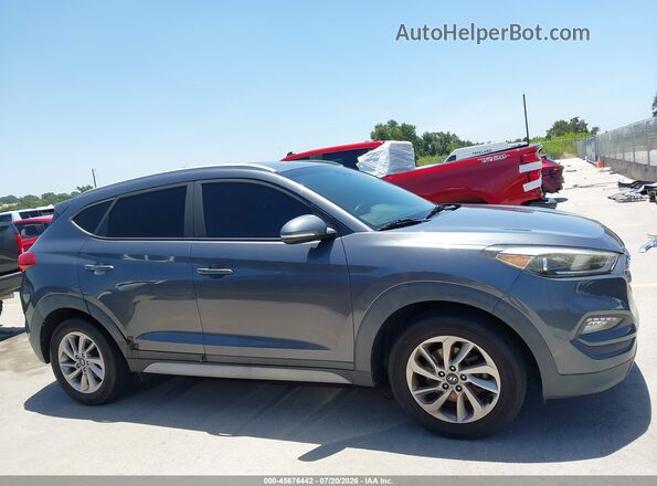 KM8J33A41HU536602 2017 HYUNDAI TUCSON Gray უკანა სალონის ხედი