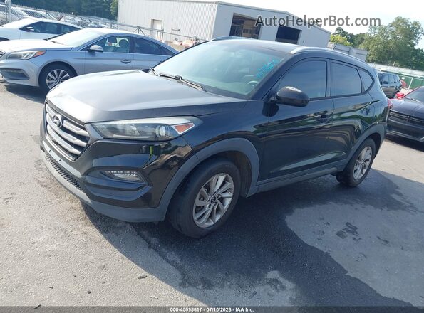 KM8J33A43GU062781 2016 HYUNDAI TUCSON Black Vista tres cuartos delantera izquierda