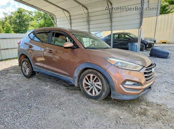 KM8J33A43GU158474 2016 HYUNDAI TUCSON Brown Front right
