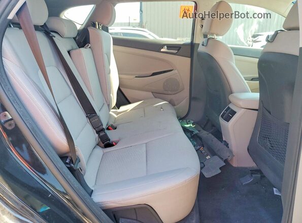KM8J33AL2KU051402 2019 HYUNDAI TUCSON Silver Rear interior view