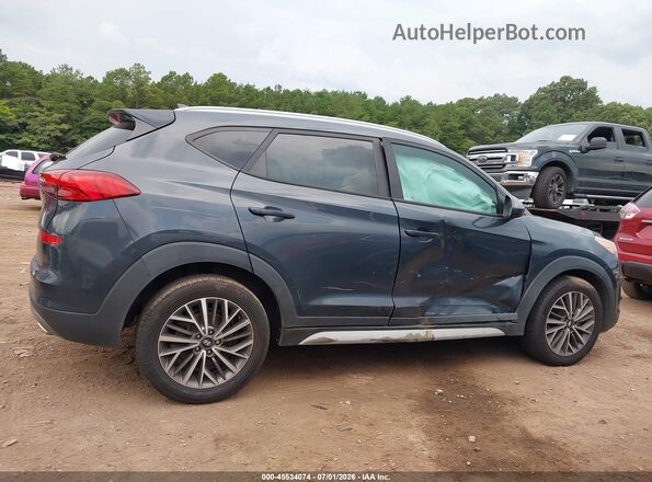 KM8J33AL2LU099595 2020 HYUNDAI TUCSON Blue Rear interior view