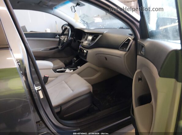 KM8J3CA20GU219875 2016 HYUNDAI TUCSON Gray Vista interior delantera
