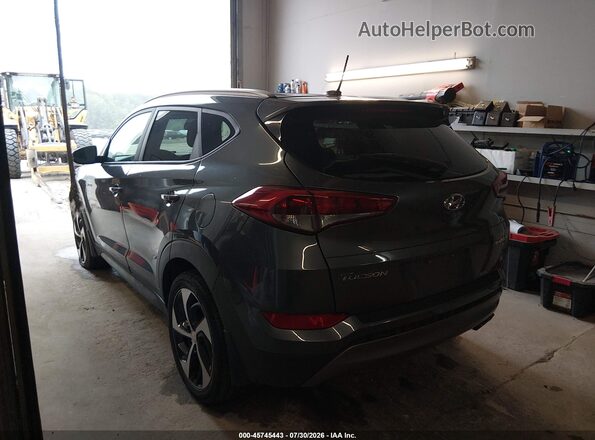 KM8J3CA20GU219875 2016 HYUNDAI TUCSON Gray Trasero izquierdo