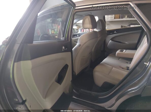 KM8J3CA20GU219875 2016 HYUNDAI TUCSON Gray Vista de la etiqueta del VIN