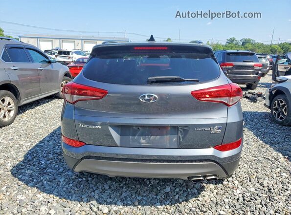 KM8J3CA20GU239558 2016 HYUNDAI TUCSON Gray უკანა ხედი