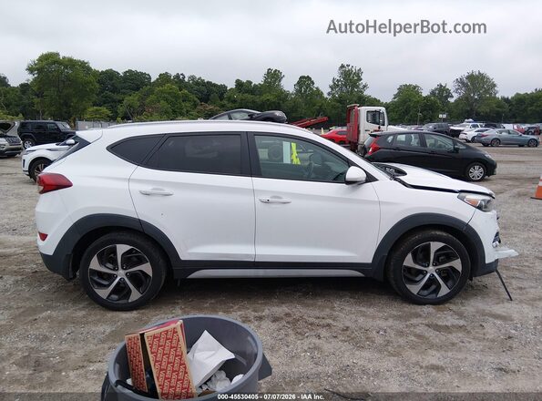 KM8J3CA21HU520110 2017 HYUNDAI TUCSON White უკანა სალონის ხედი
