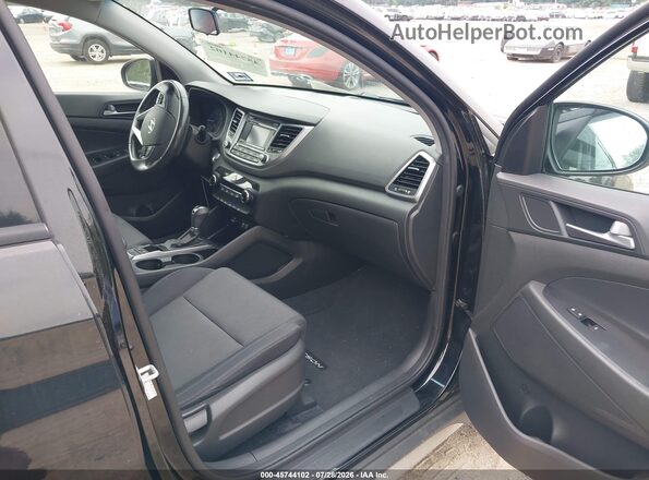 KM8J3CA22HU528894 2017 HYUNDAI TUCSON Black წინა სალონის ხედი