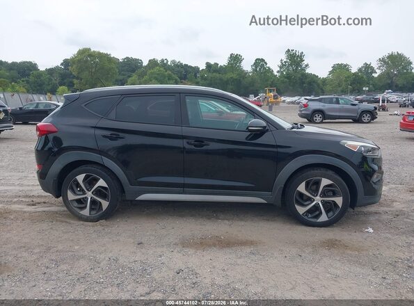 KM8J3CA22HU528894 2017 HYUNDAI TUCSON Black უკანა სალონის ხედი