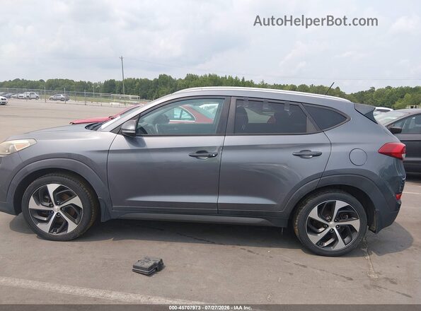 KM8J3CA27GU080330 2016 HYUNDAI TUCSON Gray უკანა სალონის ხედი