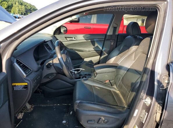 KM8J3CA2XGU074411 2016 HYUNDAI TUCSON Gray Front interior view