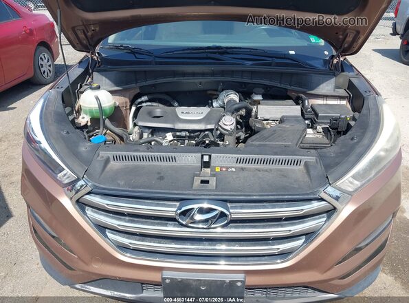 KM8J3CA2XGU110582 2016 HYUNDAI TUCSON Brown Vista frontal