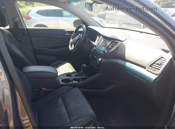 KM8J3CA2XGU178123 2016 HYUNDAI TUCSON Black Вид салону спереду