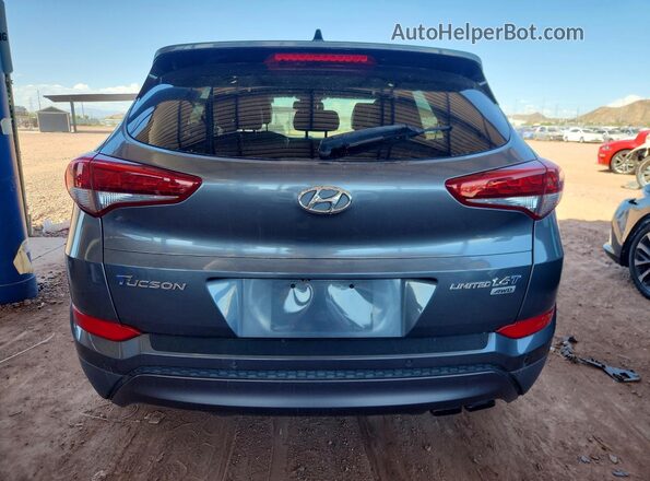 KM8J3CA2XGU178932 2016 HYUNDAI TUCSON Blue Rear view