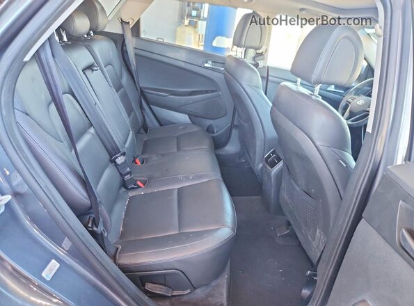 KM8J3CA2XGU178932 2016 HYUNDAI TUCSON Blue Rear interior view