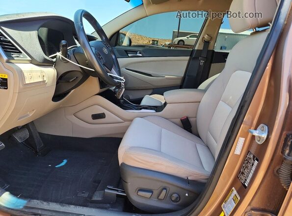 KM8J3CA2XHU314235 2017 HYUNDAI TUCSON Brown წინა სალონის ხედი