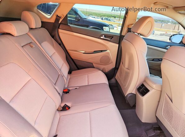 KM8J3CA2XHU314235 2017 HYUNDAI TUCSON Brown უკანა სალონის ხედი