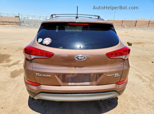KM8J3CA2XHU314235 2017 HYUNDAI TUCSON Brown უკანა ხედი