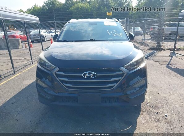 KM8J3CA44GU212316 2016 HYUNDAI TUCSON Black Widok wnętrza z tyłu
