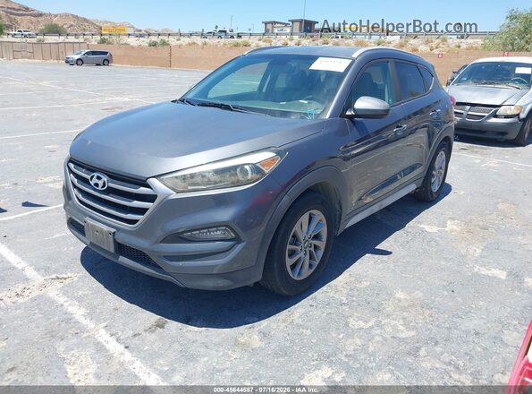 KM8J3CA44HU499111 2017 HYUNDAI TUCSON Gray Vista tres cuartos delantera izquierda