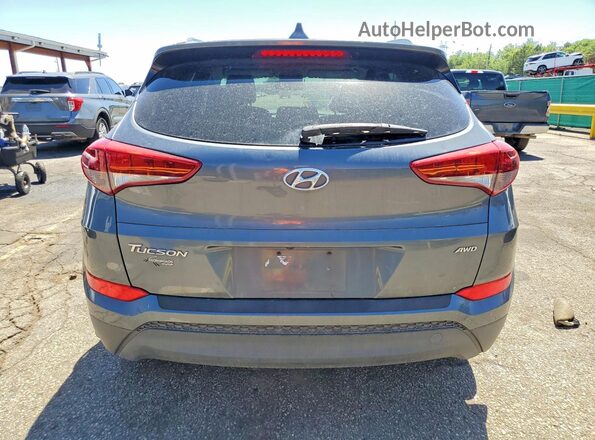 KM8J3CA44JU606941 2018 HYUNDAI TUCSON Gray Widok z tyłu
