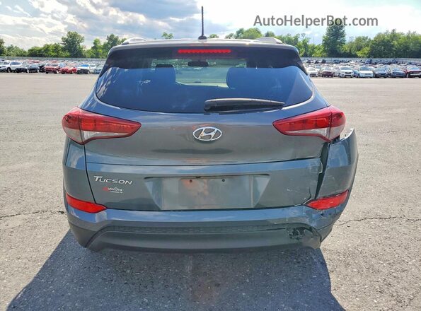 KM8J3CA45GU243204 2016 HYUNDAI TUCSON Silver Vista trasera